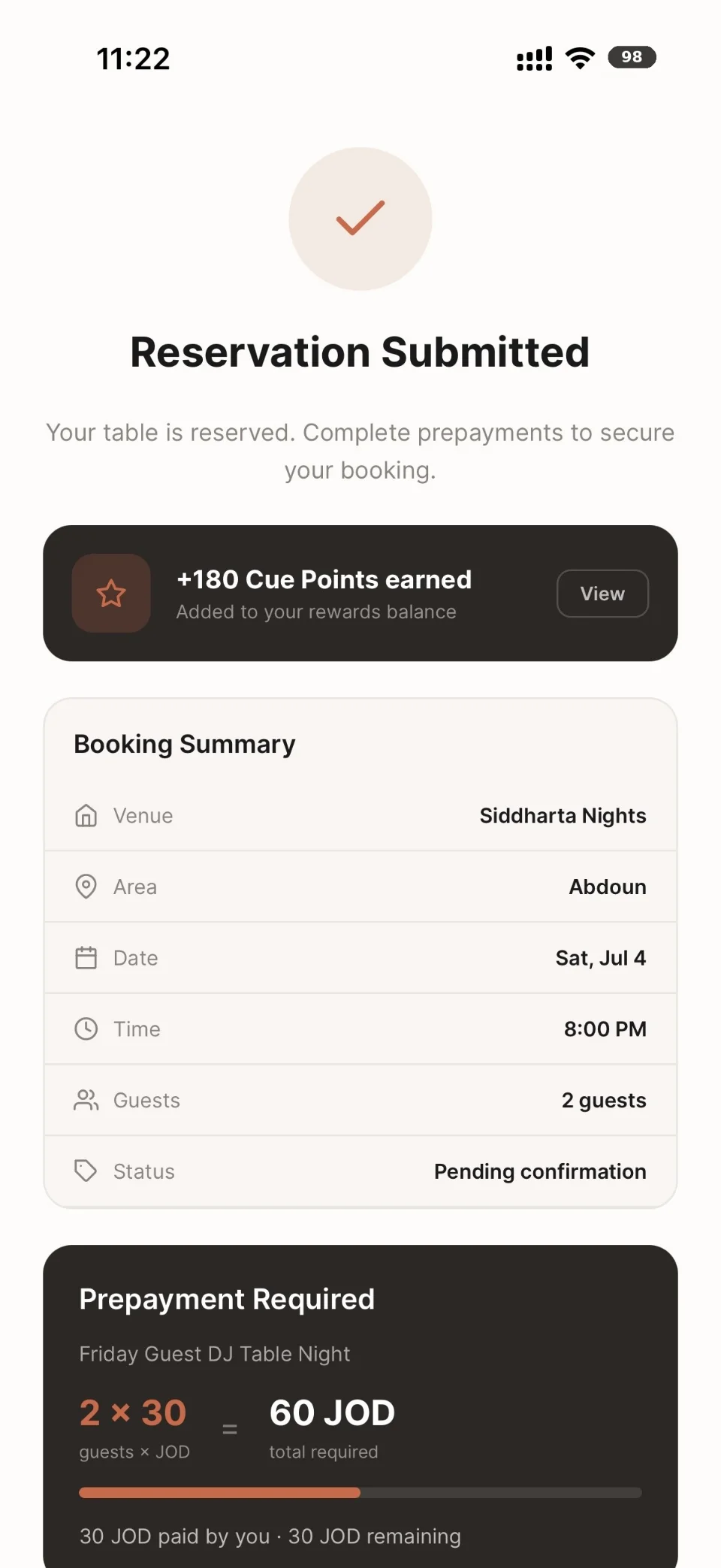 Cue guest app: the Reservation Submitted confirmation with the booking summary.